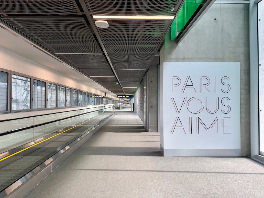 Modern airport walkway with paris vous aime art
